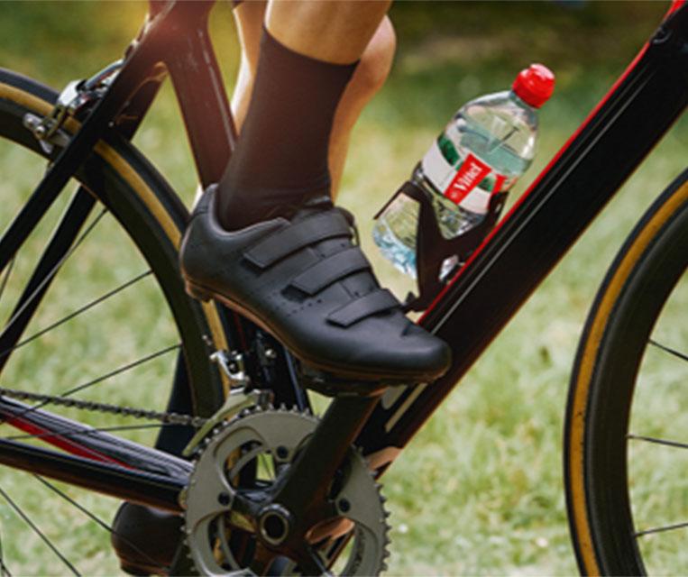bicycler`s foot and VITTEL bottle
