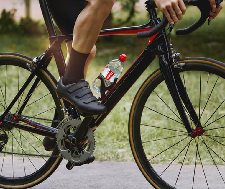 bicycler`s foot and VITTEL bottle