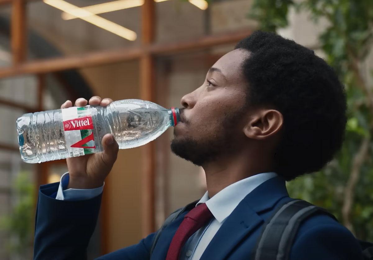 a man is drinking the VITTEL® water
