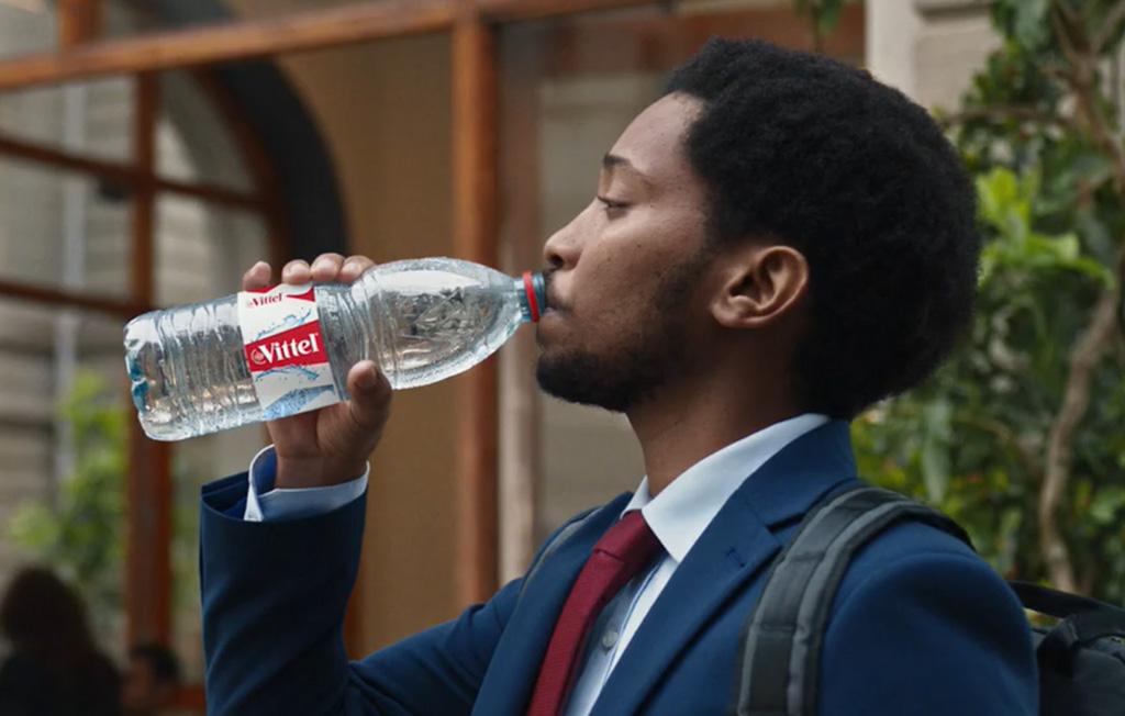 a man is drinking the VITTEL® water